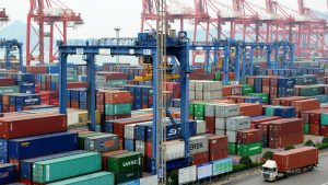 LIANYUNGANG, CHINA - APRIL 05:  A truck moves a shipping container at Lianyungang Port on April 5, 2018 in Lianyungang, China. China will fight back at any cost, Chinese authorities said Friday after U.S. President Donald Trump asked the U.S. Trade Representative to consider 100 billion U.S. dollars of additional tariffs on China.  (Photo by VCG/VCG via Getty Images)